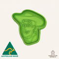 Green cookie cutter shaped like a face with a hat on a white background, featuring 'Australian Made' and 'Cookie Cutter Emporium' logos.