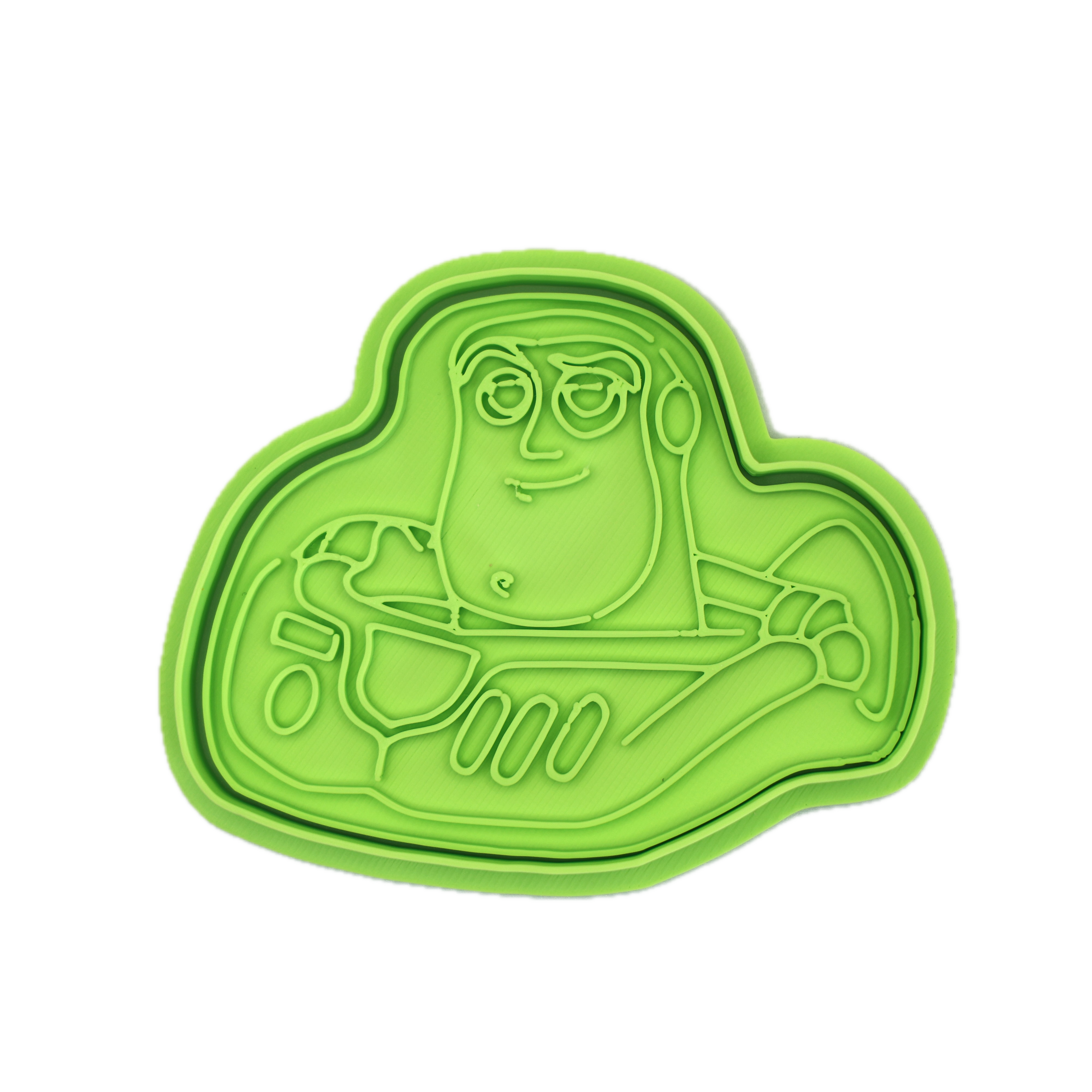 Green cookie cutter shaped like a space hero character.