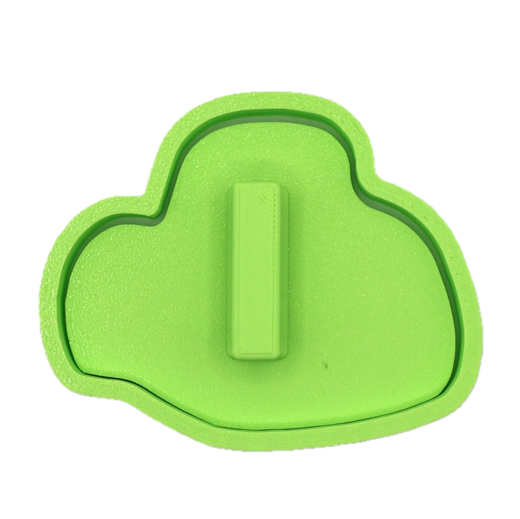 Green cookie cutter and fondant stamp with a handle on the back