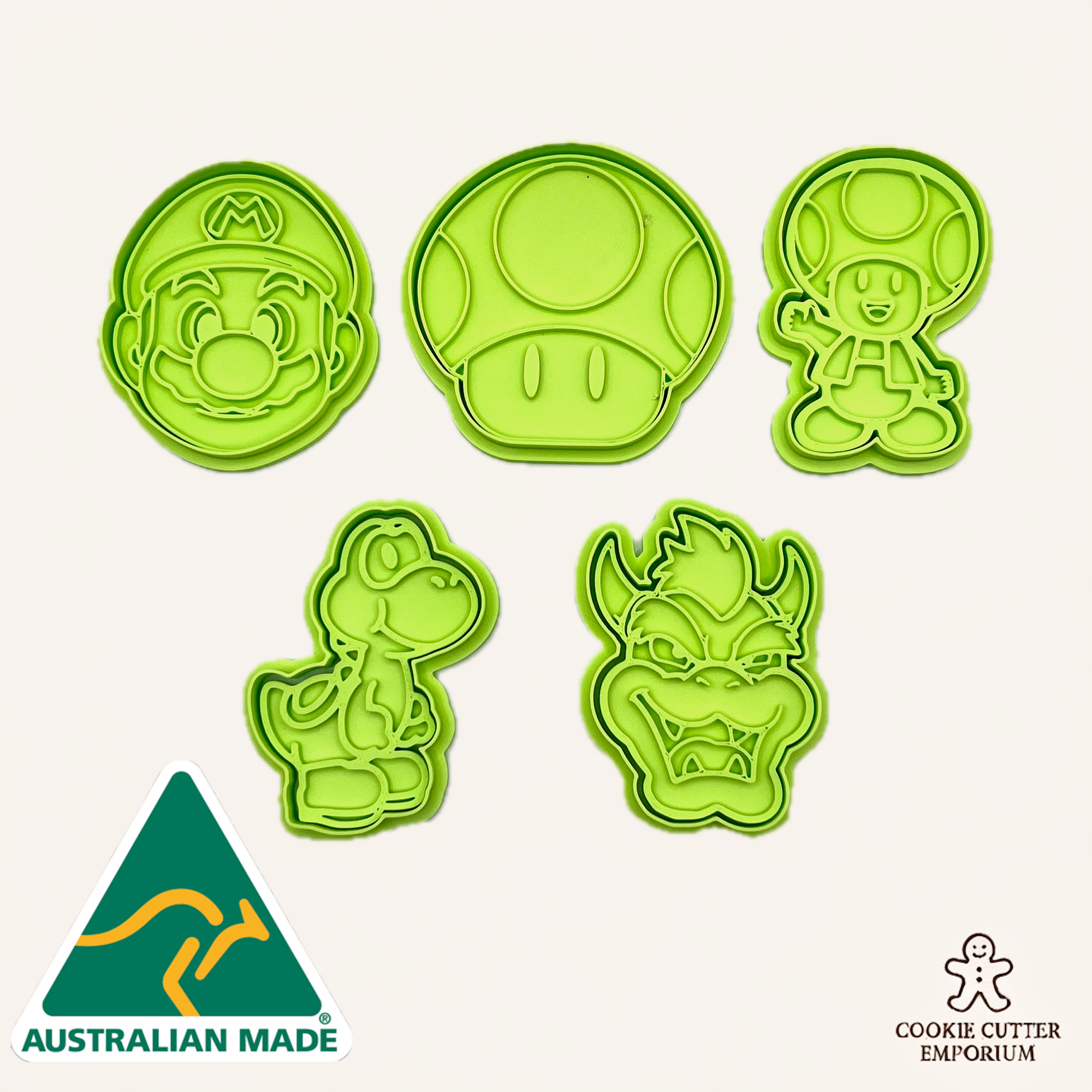 Set of green cookie cutters with various shapes on a white background, featuring 'Australian Made' and 'Cookie Cutter Emporium' logos.