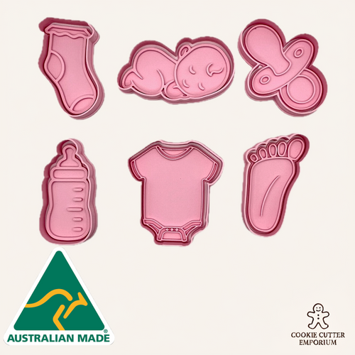 Set of pink cookie cutters shaped like baby items on a white background with 'Australian Made' and 'Cookie Cutter Emporium' logos.
