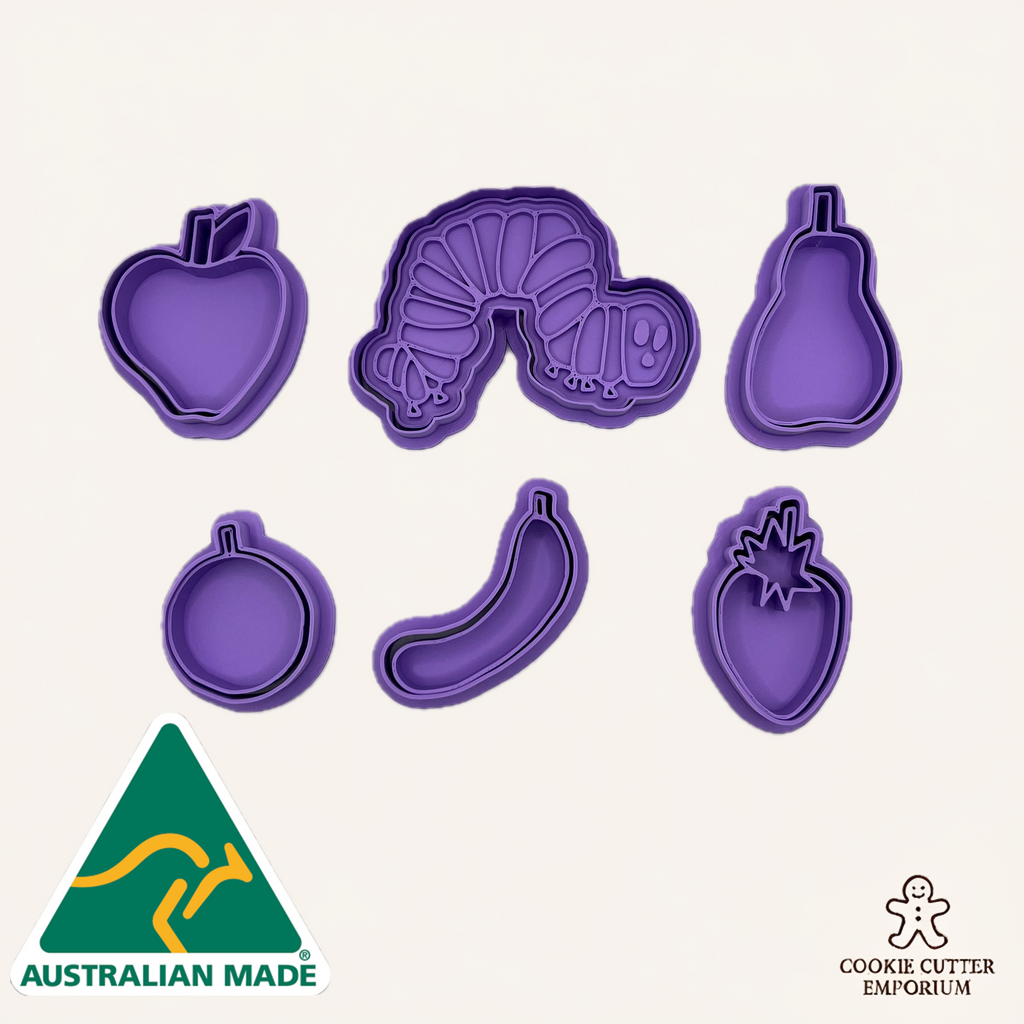Set of purple cookie cutters shaped like fruits and a caterpillar on a white background with 'Australian Made' and 'Cookie Cutter Emporium' logos.