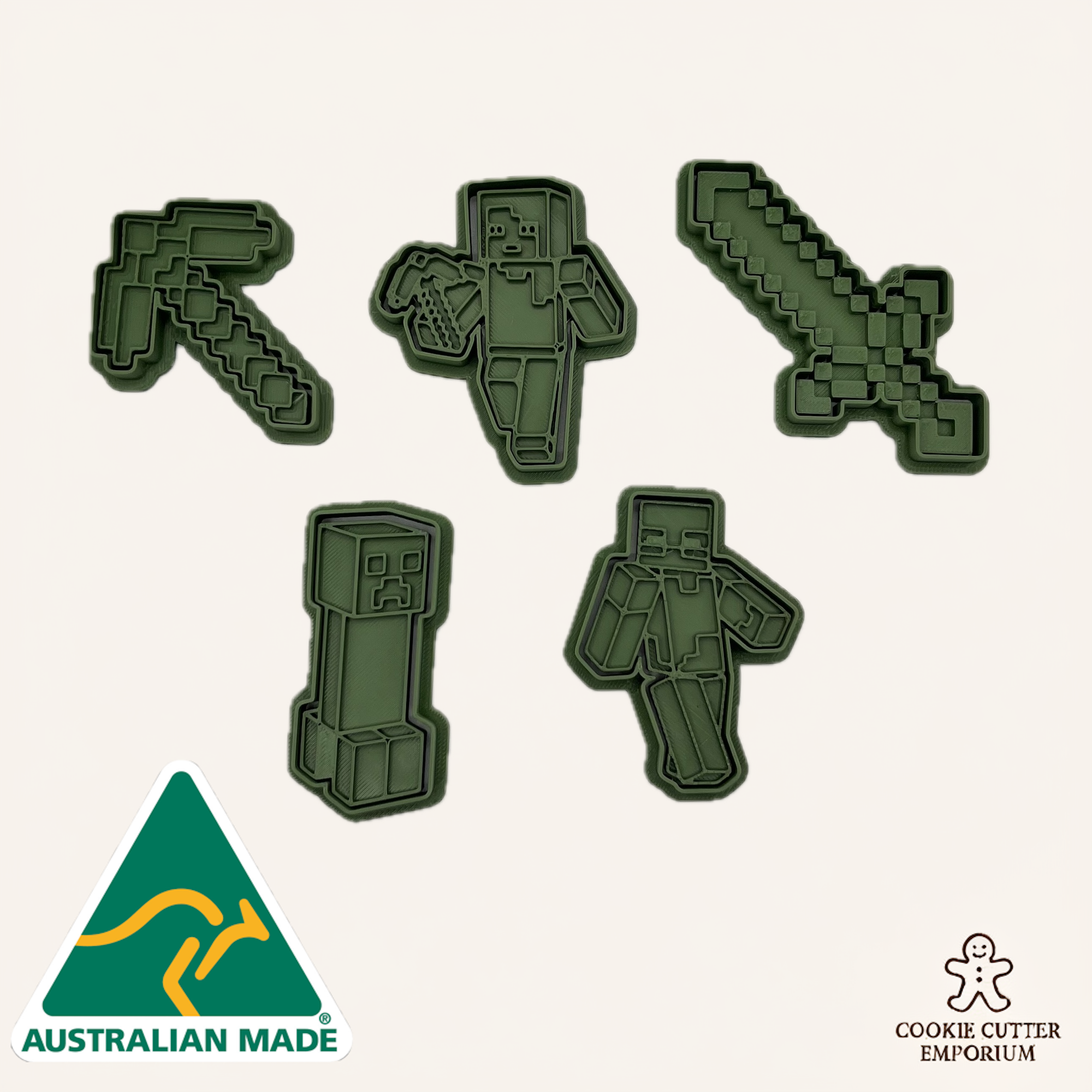 Set of green cookie cutters shaped like gaming characters on a white background.